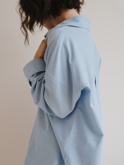 Woman wearing blue blouse Minimal Wardrobe